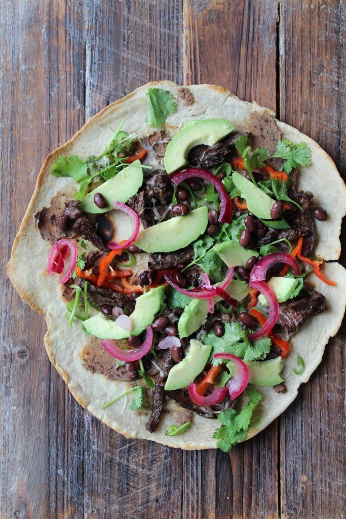 Tlayuda: Mexicos sprøde svar på pizza fyldt med saftigt oksekød, bønner og smeltet ost